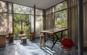 interior view of gass house with furniture and curtains