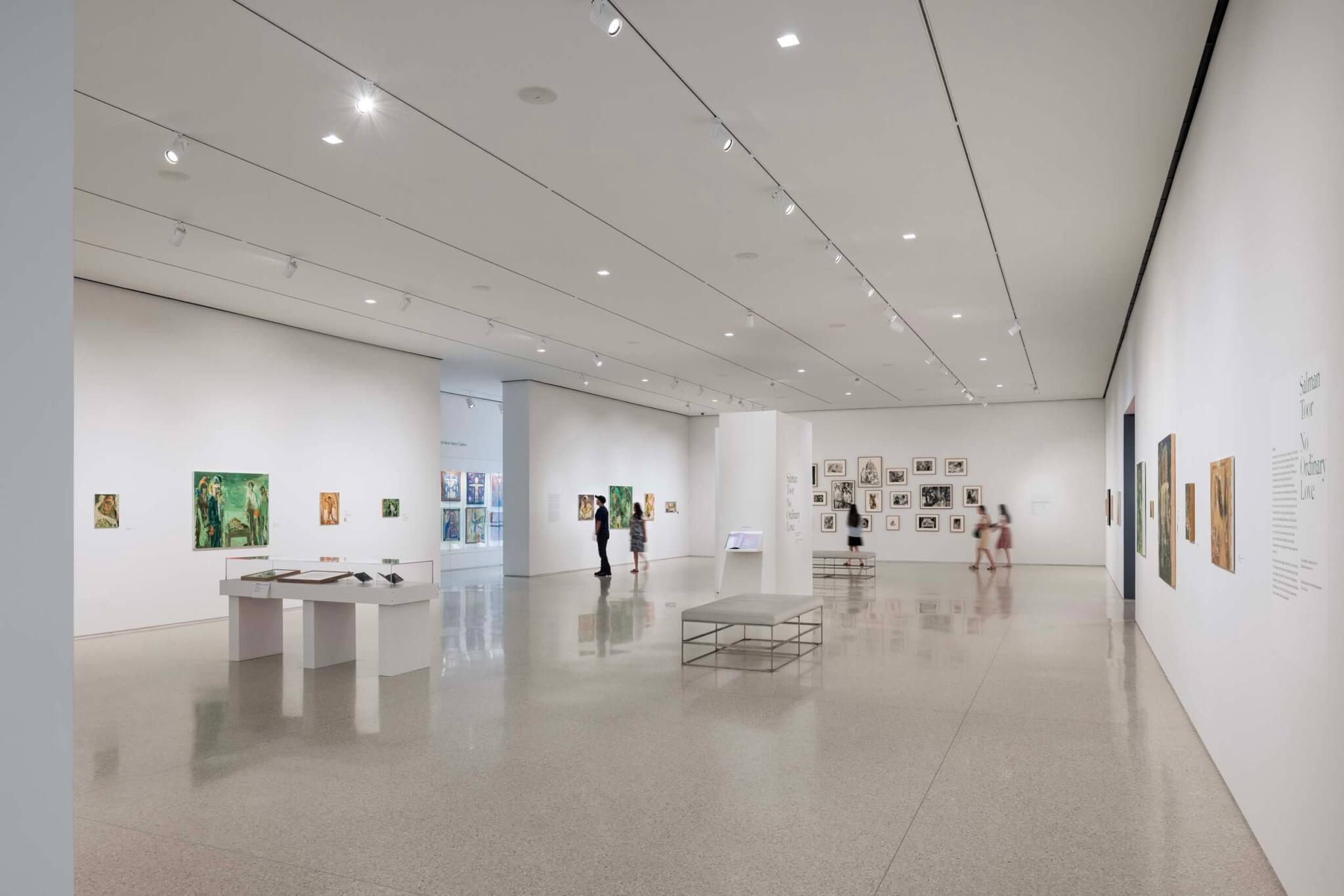 gallery with art hung on the walls and displayed on tables