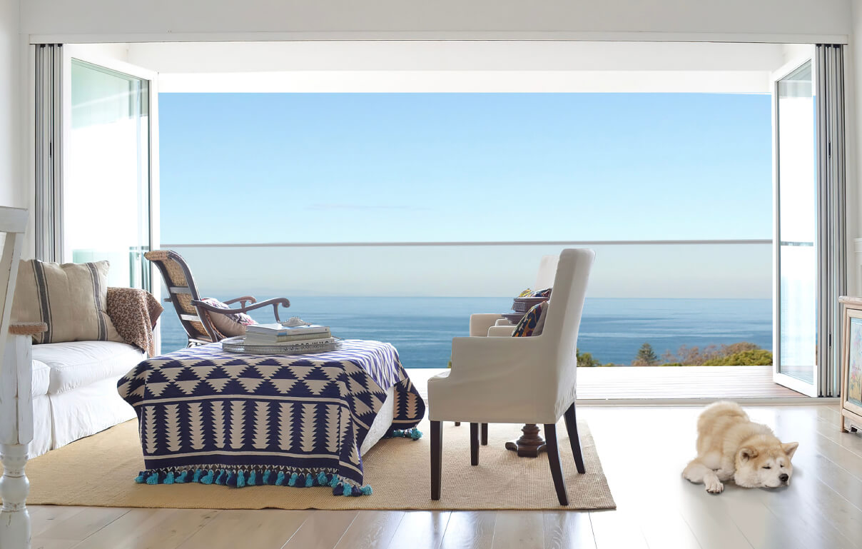 glass doors open to ocean view