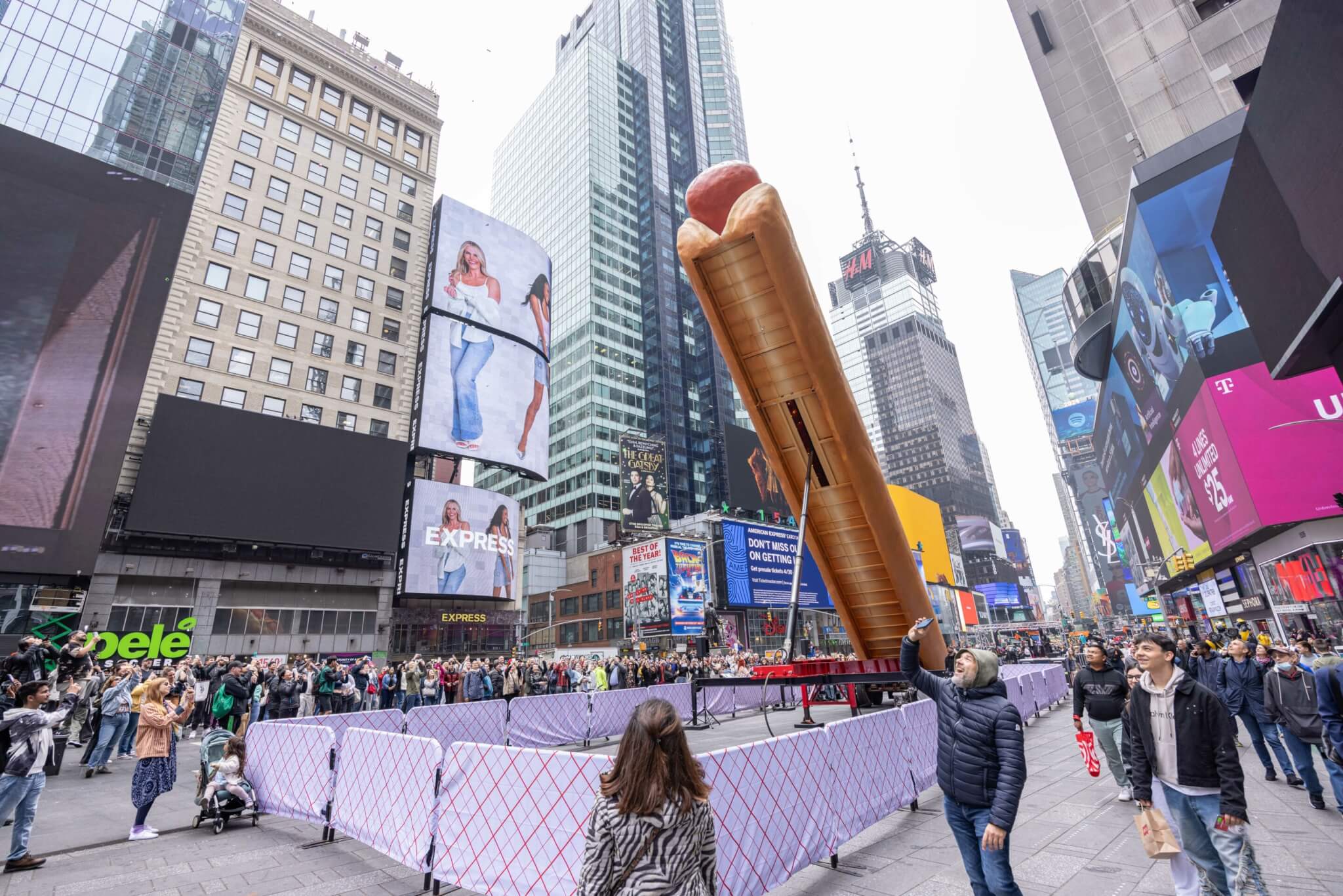hot dog sculpture standing upright